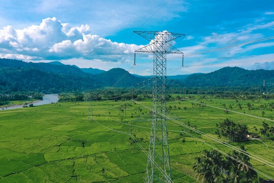 beautiful aerial view of an electric tower against the backdrop of vast rice fields in Bonjol District, Pasaman Regency, West Sumatra
