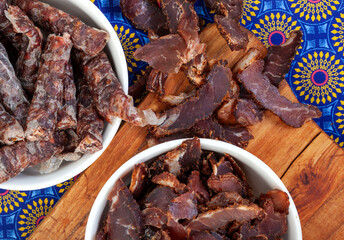 South African Traditional Biltong and dry wors on blue traditional printed cloth. 