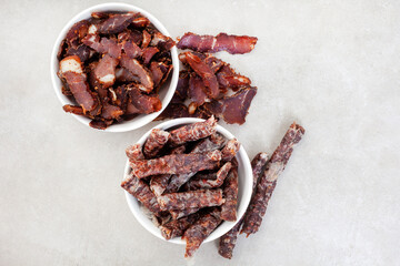 South African Traditional Biltong and dry wors on grey