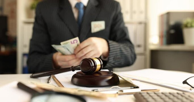 Judge or lawyer with money and judge gavel on table. Dollars bill corruption cost and finance and expenses salary