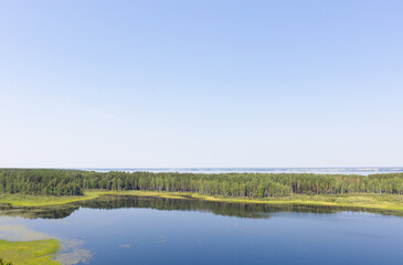 Fototapeta na wymiar Aerial photo of forest boggy lake in the Karakansky pine forest near the shore of the Ob reservoir.