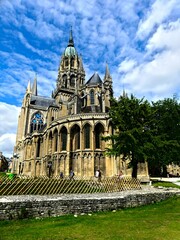 Fototapeta na wymiar Bayeux, August 2023 - Visit the magnificent medieval town of Bayeux in Normandy - View of the magnificent Notre-Dame de Bayeux cathedral