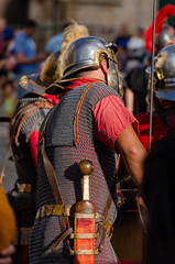 Man equipped as a Roman legionary, at a historical recreation party.