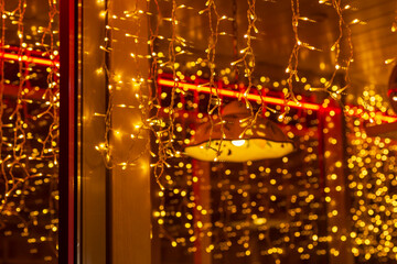 lights in window of cafe at Christmas