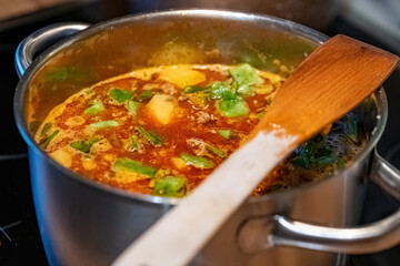 potato stew with beans in a saucepan