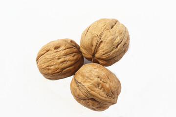  whole walnuts on white background