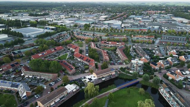 Aerial of a beautiful suburban neighborhood. The houses have photovoltaic solar panels on the rooftops