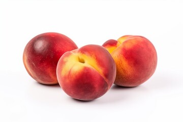Obraz premium Three ripe peaches on a clean white surface