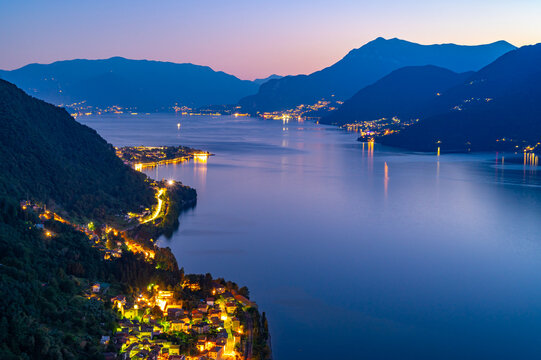 A view of Lake Como from the church of San Rocco, in Dorio, towards the south, with Bellagio, the mountains, the panorama, at dusk
