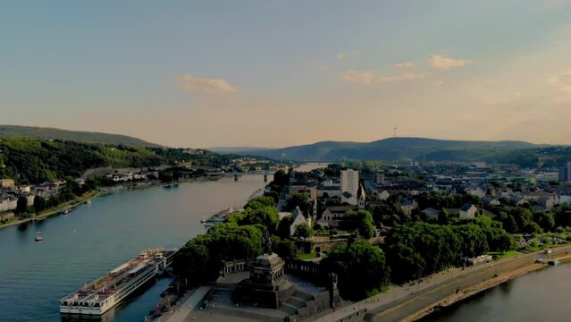 Deutsches Eck or German Corner headland in Koblenz, where the Mosel river joins the Rhine in Koblenz Germany during sunset