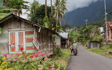 Travel Tourist in Indonesia on scooter at Danau Maninjau in Sumatra  © El Benedikt