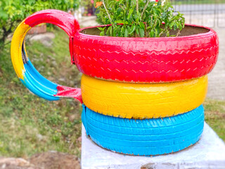 Plant pot with cup design made of tire waste. Recycle reuse reduce or 3r, environmental cleanup and DIY concept.