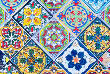 Background from ceramic tiles on the wall with different color decorations