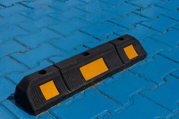 Fototapeta premium Parking Lot Safety: Close-up of Rubber Stopper