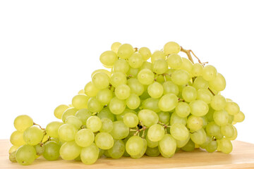 Sweet organic grapes on bamboo kitchen board, macro isolated on white background.