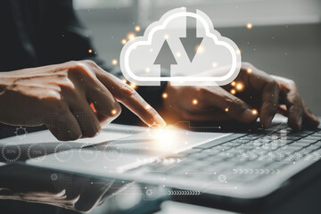 Business intelligence concept with chart and graph icons on digital screen interface and businessman analyzing data for financial analysis. Cloud computing