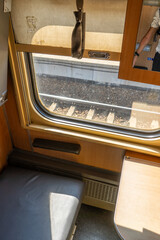 Recumbent seat compartment in the old train Warsaw - Kyiv. View from inside Ukrainian high speed train