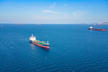 Fototapeta premium Aerial view of Oil chemical tanker sea ship anchored in sea waiting entering port