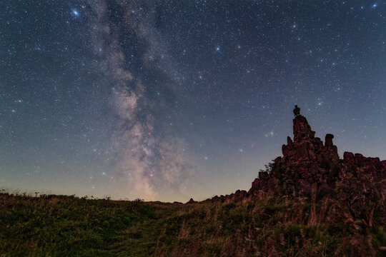 The Milky Way over the summit of the mountain Wasserkuppe in the Rhoen in Germany.