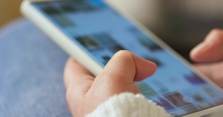 Woman hands using smartphone scrolling social media picture gallery  - Powered by Adobe