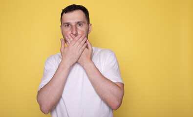 Man closes a mouth hands. I will not say anyone. 