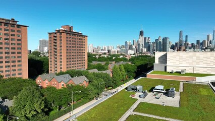 Green roof on building in Chicago, Illinois. Large American city taking preventative measures to stop climate change and global warming. Grasses on industrial roof.