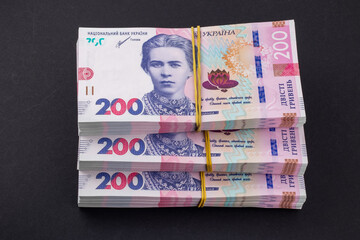 Obraz premium Stack of ukrainian money hryvnia. grivna, hryvna with 200 banknotes
