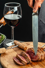 Beef steak and red wine. Grilled meat on wooden cutting board. banner, menu, recipe place for text, top view