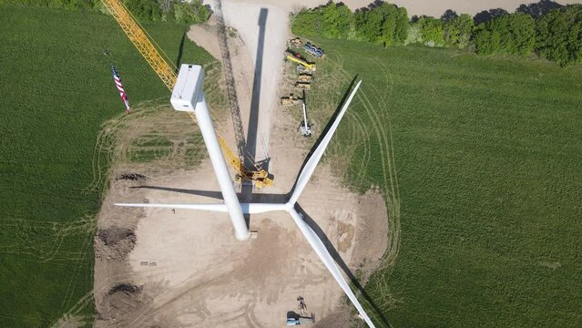 Wind turbine blade on ground ready to be lifted, aerial drone view