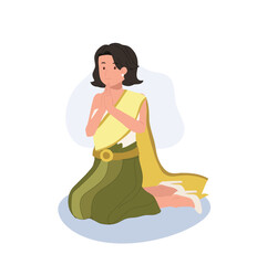 Thai Culture concept. Thai woman in traditional dress is sitting and praying , making wai. Praying Gesture