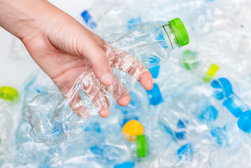 Plastic bottles in black garbage bags waiting to be taken to recycle.