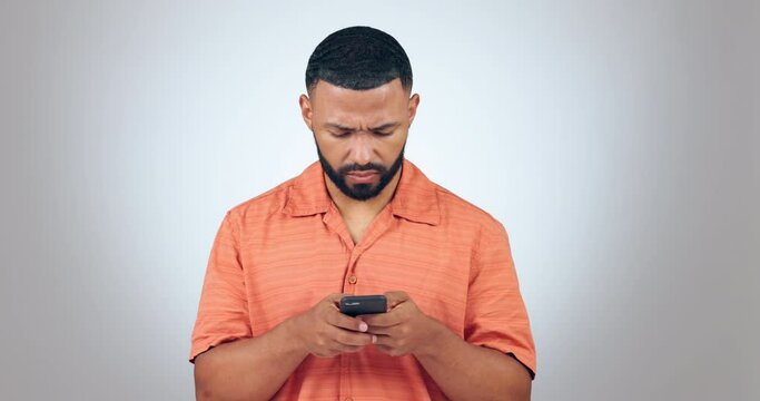 Phone, stress and angry man in studio with wtf, text or fake news comment on grey background. Smartphone, fail and male model frustrated by 404 error, glitch or phishing, scam or social media hacker
