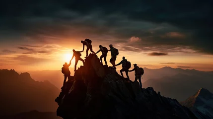 Foto op Canvas Group of people on peak mountain climbing helping team work © IBEX.Media