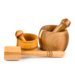 Set of wooden pestles and mortars isolated on a white.