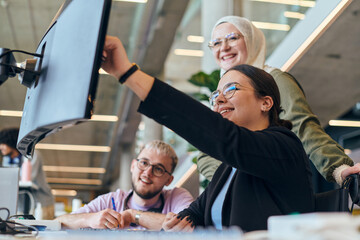 In a modern startup office, a diverse group of young professionals collaboratively tackles various...
