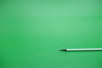 pen refill isolated green background