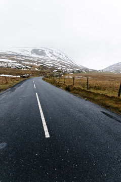 Road leading up to snow covered Mourne Mountains, Northern Ireland