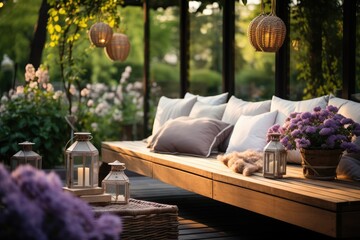 House with terrace featuring plants, wooden walls, and a table. Comfortable sofa with cushions, flowers, and lanterns.