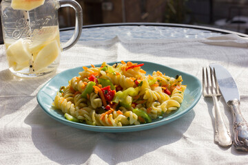 Pasta salad with fresh vegetables.