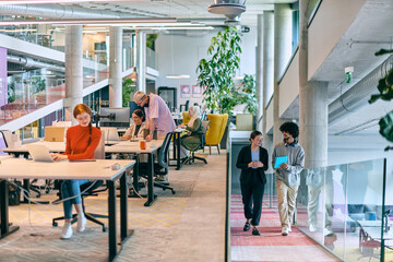 In a modern startup office, a diverse group of young professionals collaboratively tackles various business problems and challenges, surrounded by their engaged colleagues, fostering innovation and