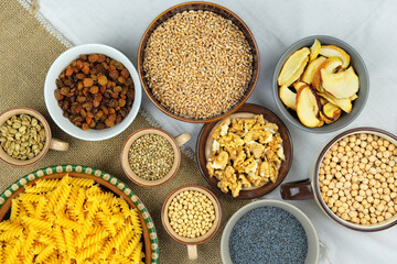 Various vegetarian organic products in bowls. Vintage view. Rural style. Top view.