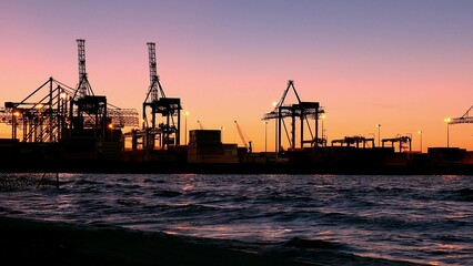 Container Ship Terminal and Cranes in the Evening