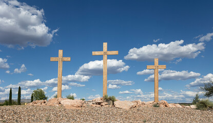 Three Christian Crosses with Clouds and Blue Sky