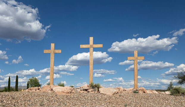 Three Christian Crosses with Clouds and Blue Sky