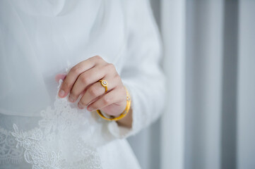 portrait of muslim bride in white wedding dress stand on white background.concept for love and ceremony in wedding day.vertical image