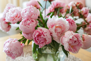 Beautiful pink peonies at home, closeup. Interior design