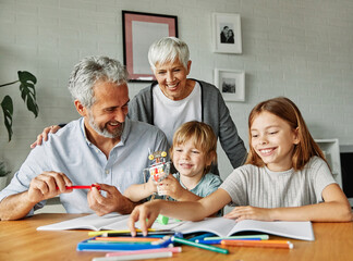 Fototapeta premium grandchild family child grandparent grandfather grandmother homework education home together learning school studying