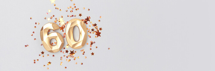 Banner with golden number 60 and stars confetti on a blue background. Festive concept with place...