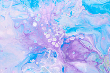 Exclusive beautiful pattern, abstract fluid art background. Flow of blending purple lilac blue paints mixing together. Blots and streaks of ink texture for print and design.