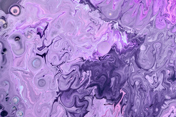 Fototapeta premium Exclusive beautiful pattern, abstract fluid art background. Flow of blending purple lilac paints mixing together. Blots and streaks of ink texture for print and design